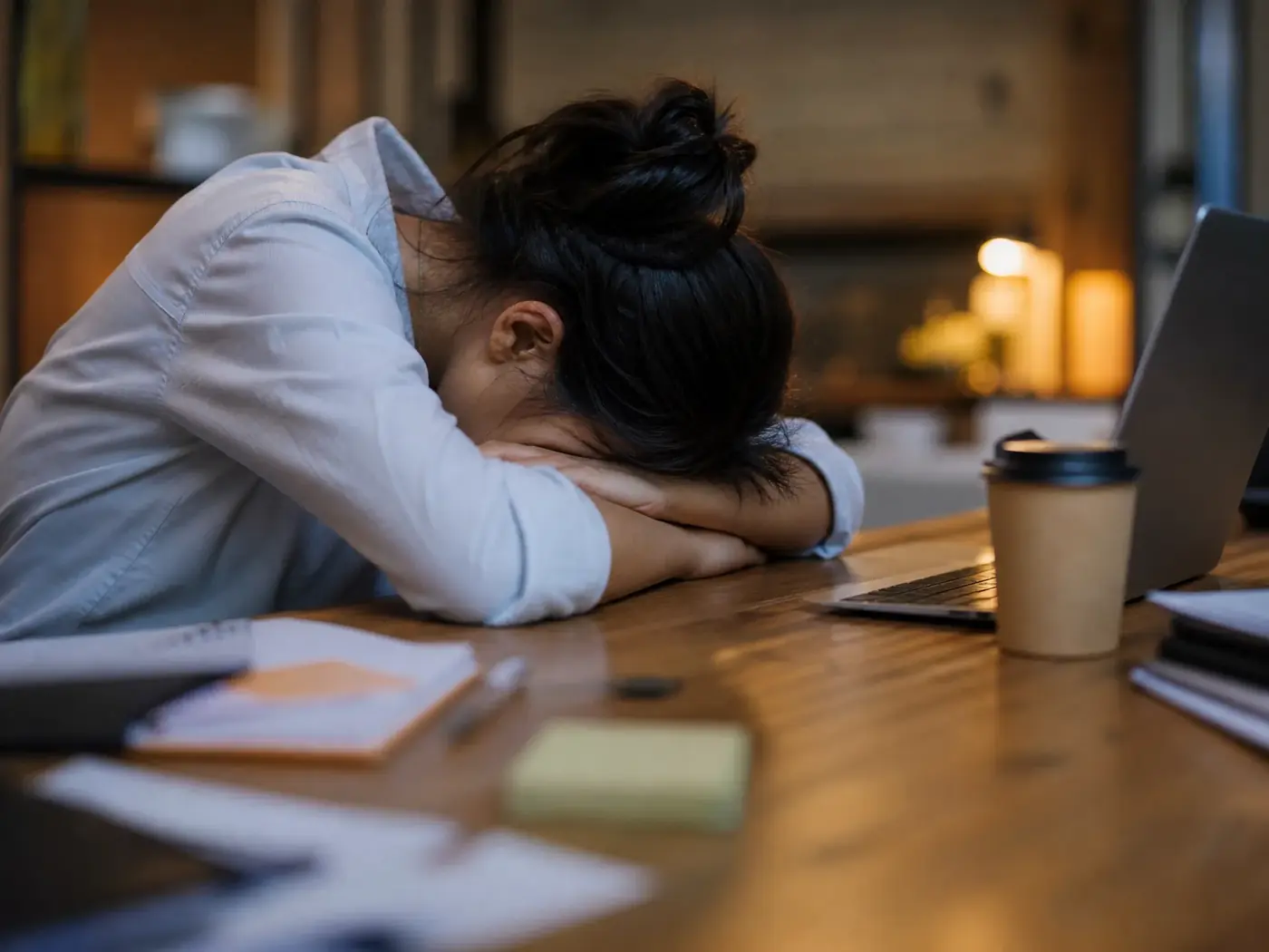 Chronic fatigue and brain fog – naturopath Isabelle Spring Exhausted person at a desk illustrating chronic fatigue and brain fog